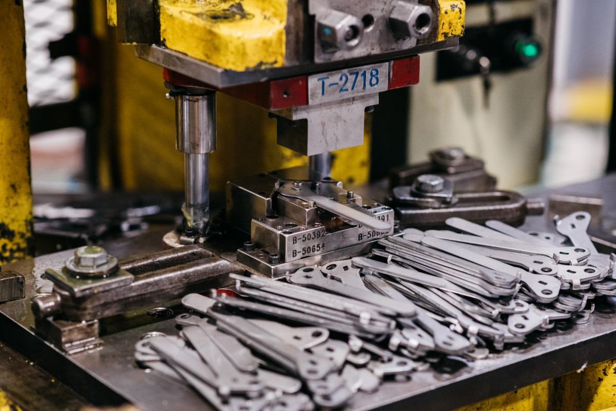 Stamped metal valve handles on a machine.